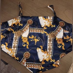 Blue, gold, and white satin tie around top. M